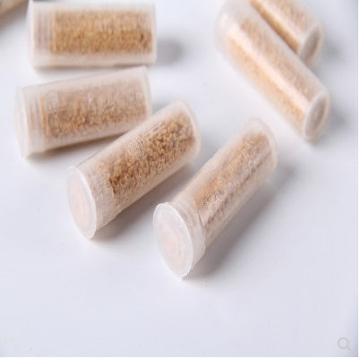 granular cockroach bait pellets in clear containers for effective insect control. chinese roach bait